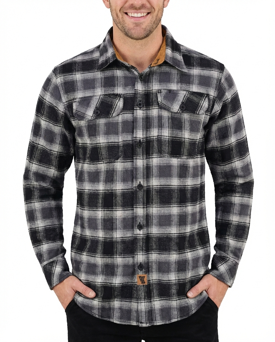 Model wearing a Castlerock men's charcoal, gray and ivory plaid flannel shirt with long sleeves and two chest pockets.