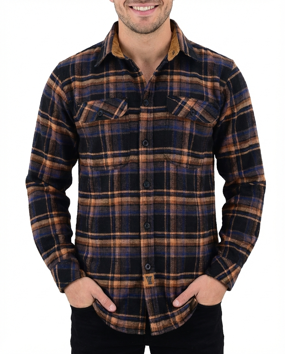 Man wearing the Midnight Rust long-sleeve flannel shirt in navy, brown and rust plaid with two chest pockets.