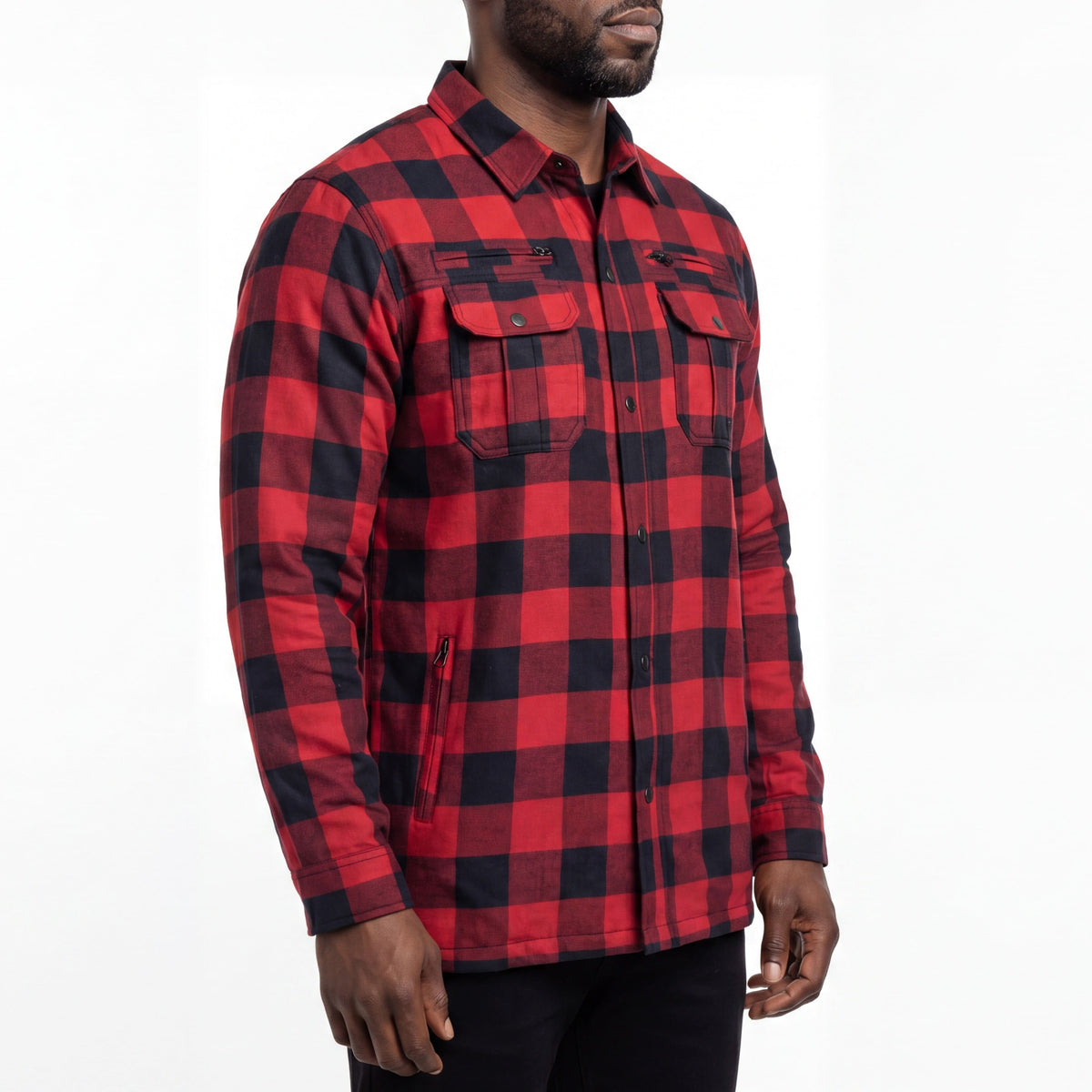 Model wearing a red and black armored riding shirt at an angle showing chest pockets and a zippered waist pocket.
