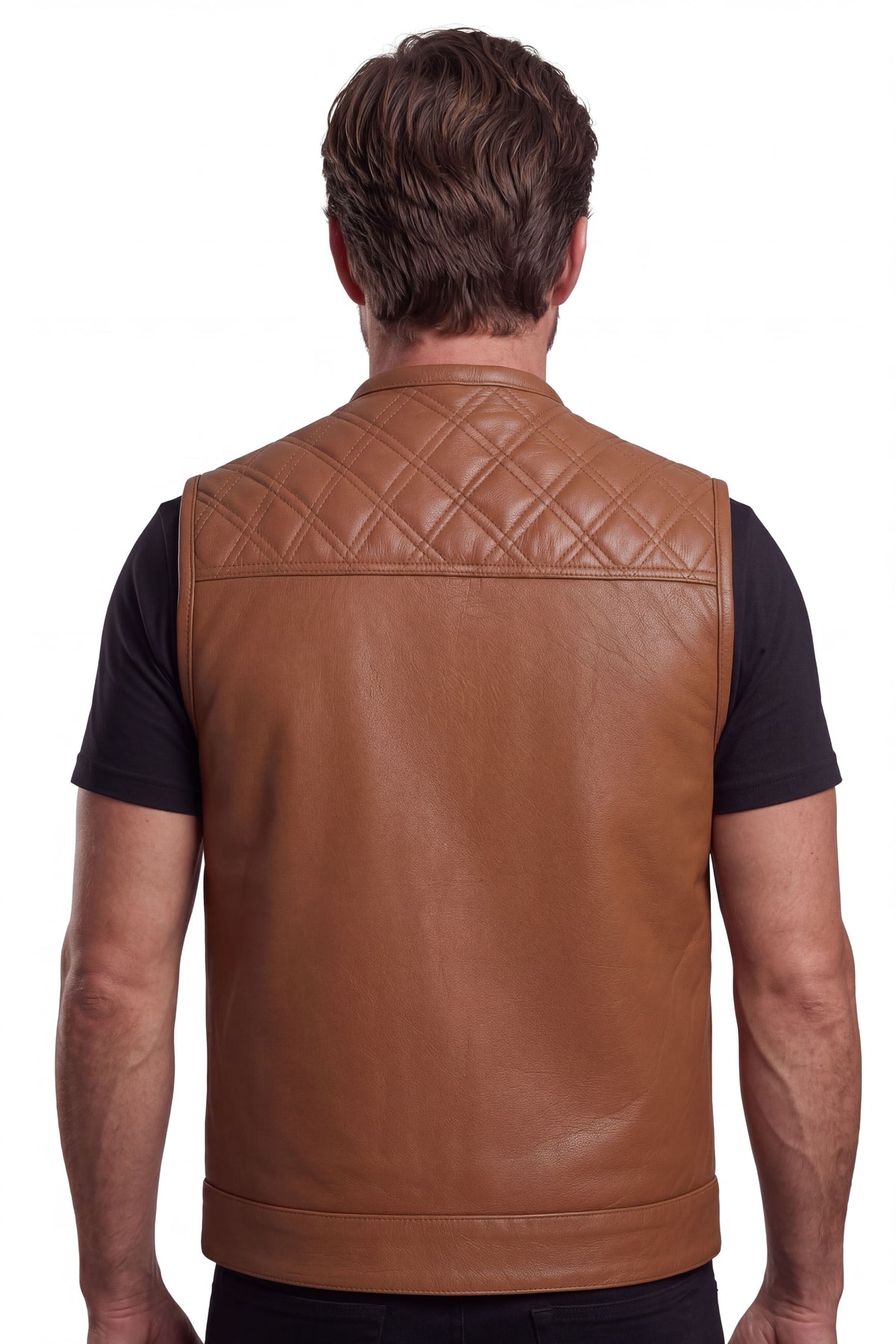 Rear view of a man wearing the cognac leather biker vest with a diamond-quilted shoulder yoke and plain back panel.