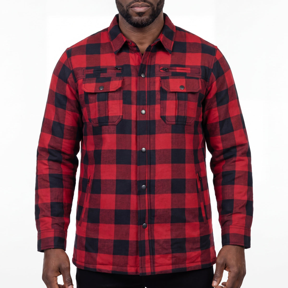 Front view of a model wearing a red and black plaid armored motorcycle flannel shirt with chest pockets.