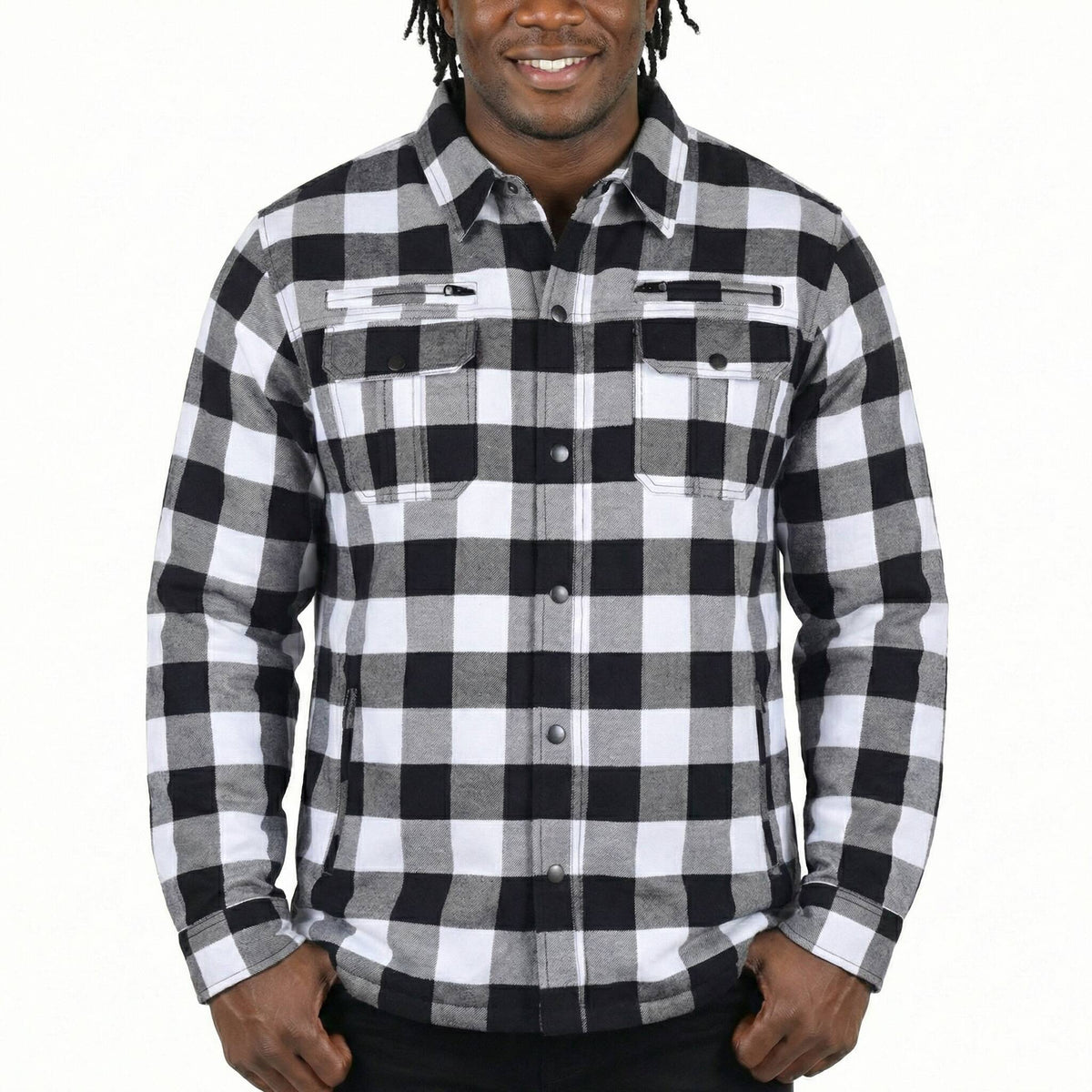 Model wearing a white and black plaid armored motorcycle shirt showing front chest vents and flap pockets.