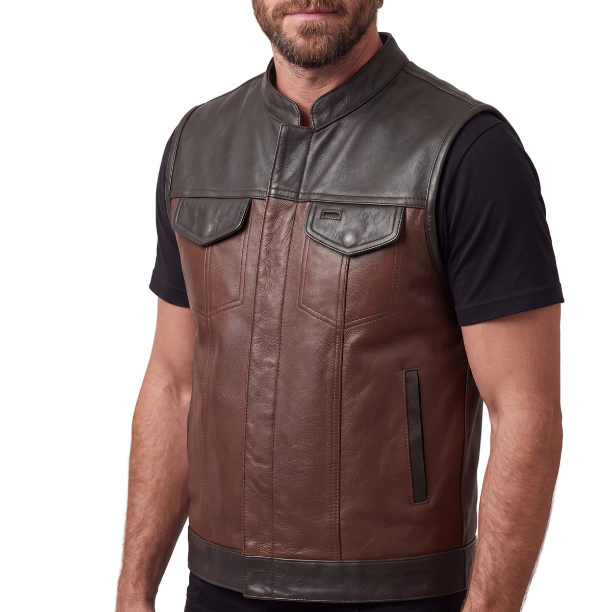 Angled view of a man wearing the two-tone leather motorcycle vest, showing black shoulder panels and a lower welt pocket.