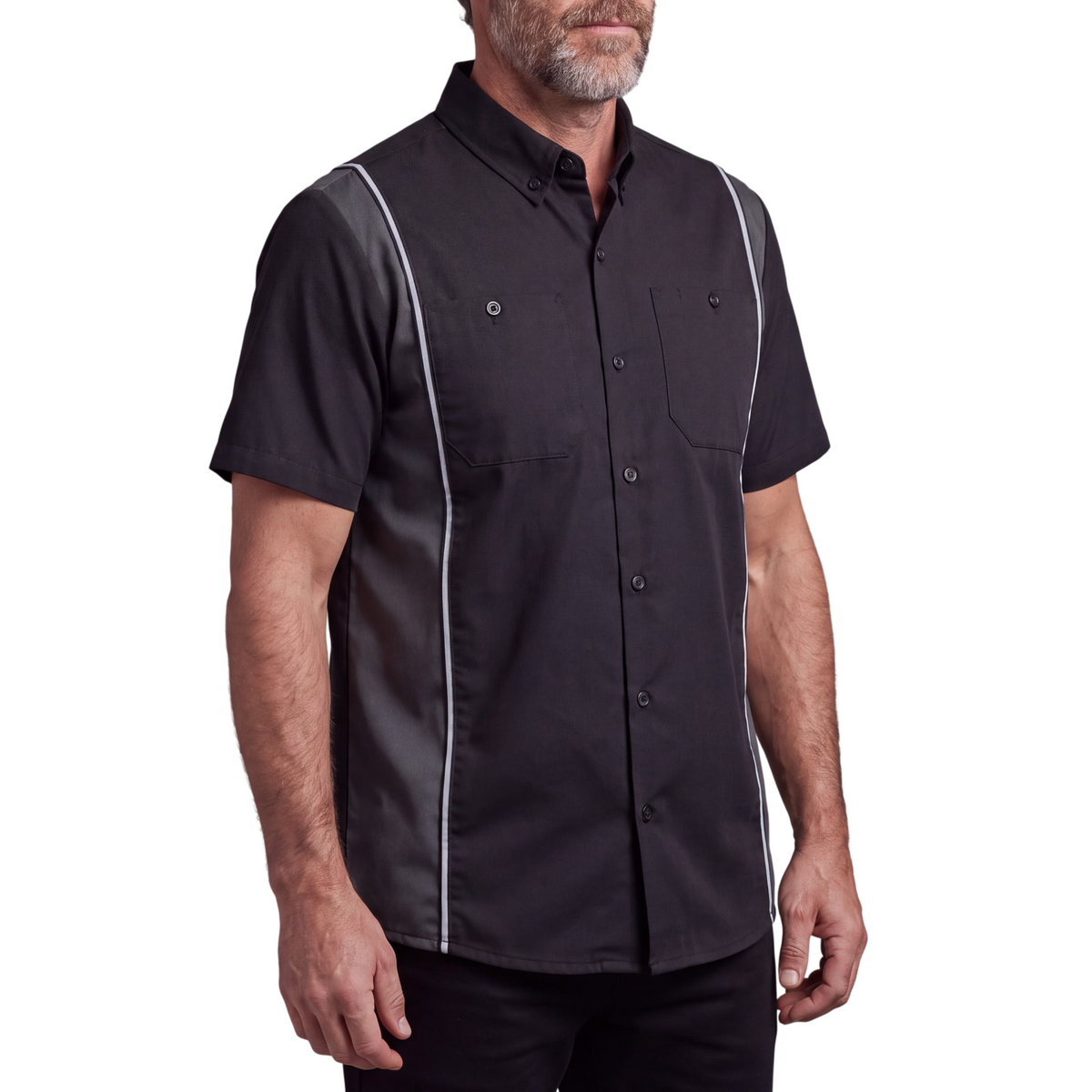 Angled view of a model in a Vance black and grey button-up work shirt, showing short sleeves and reflective trim.