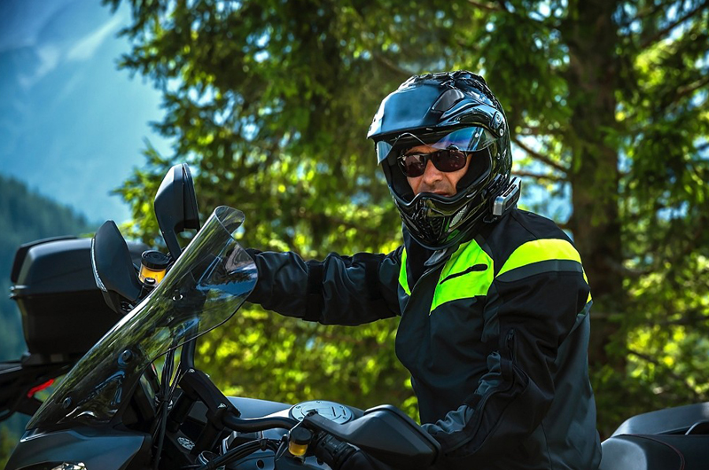 A cool biker wearing a dual-sport helmet