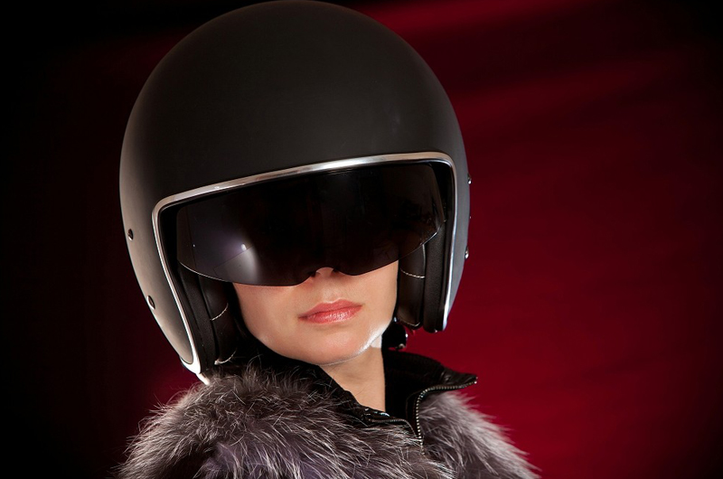 A woman wearing an open-face helmet